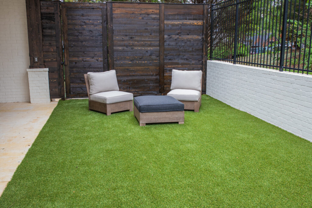 patio furniture resting on a synthetic lawn