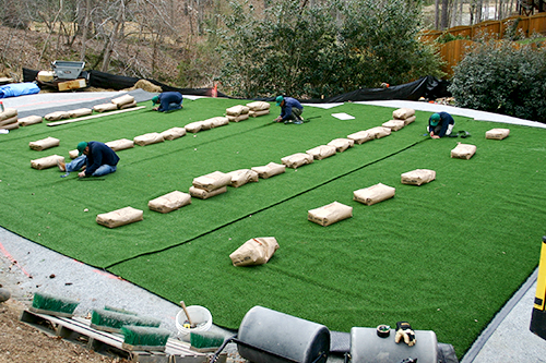 turft team installing an outdoor putting green