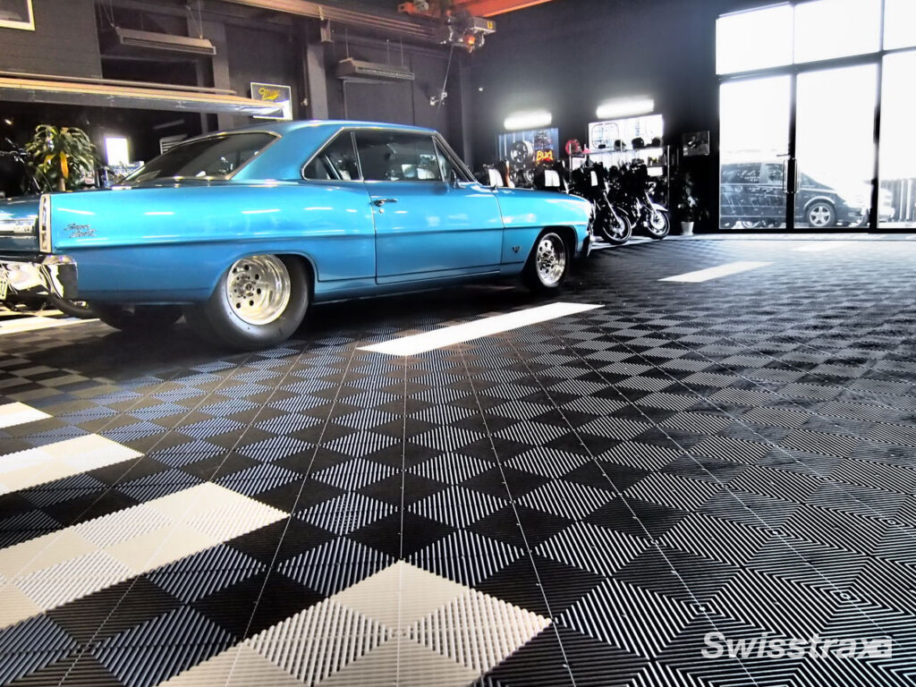 classic car parked in a garage with swisstrax flooring