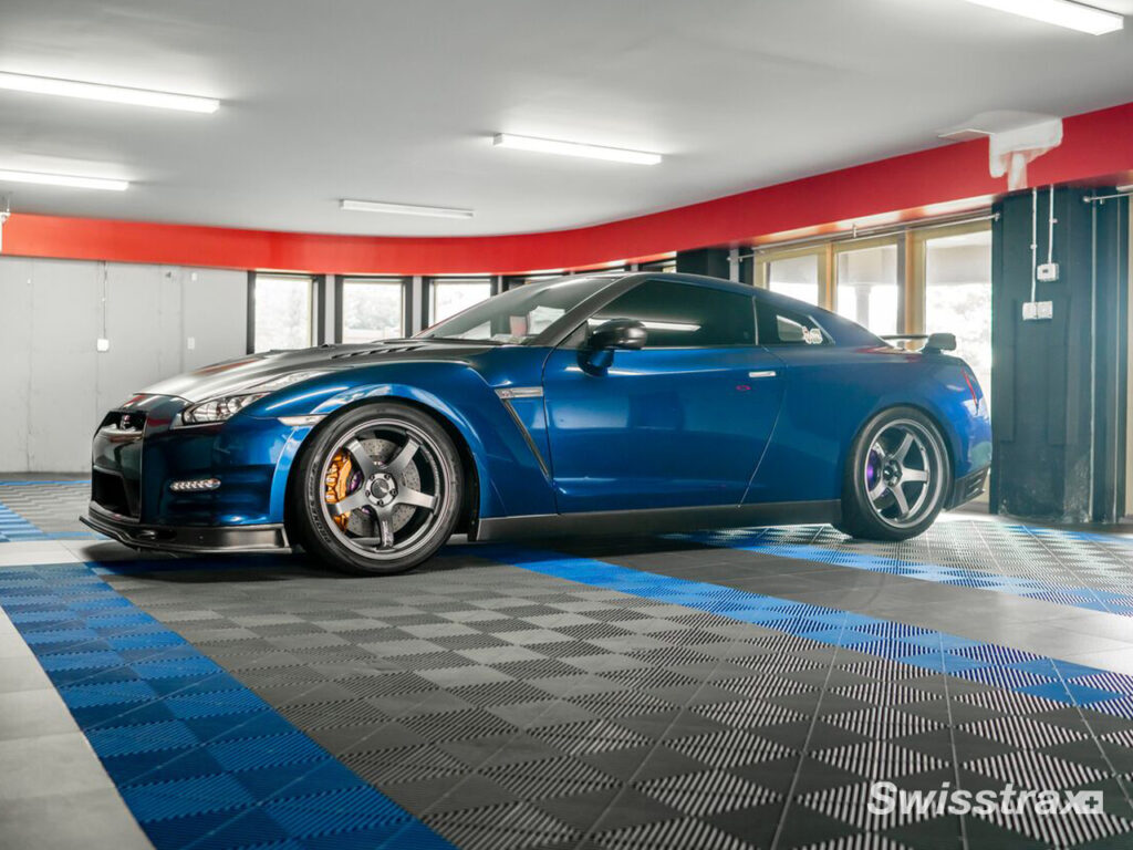 sports car parked on top of swisstrax flooring